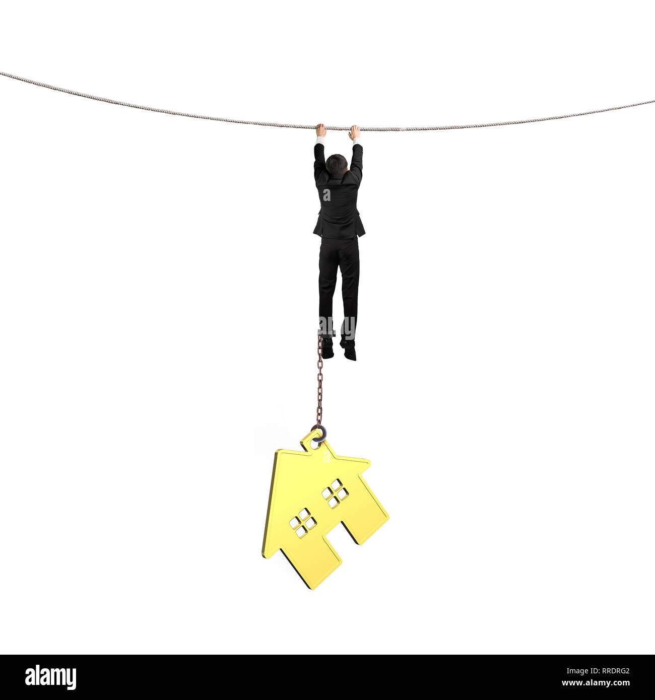 Businessman shackled by gold house hanging on the rope, isolated on white background. Stock Photo