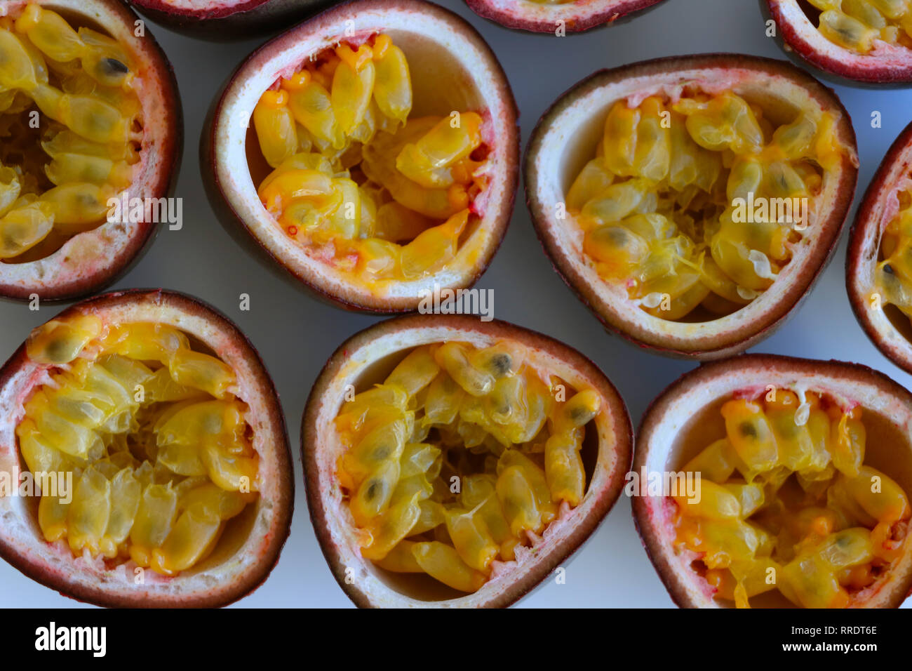 Close-up of passion fruit halves isolated on a white background top view Stock Photo