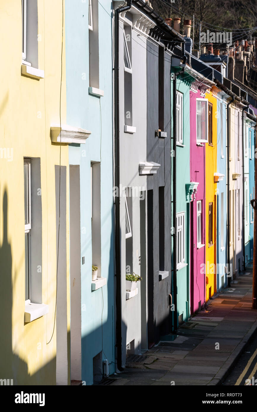 BRIGHTON, ENGLAND - FEBRUARY 25: Springlike sunshine brightens colourful terraced housing on February 25, 2019 in Brighton, England. (Photo by Andrew  Stock Photo