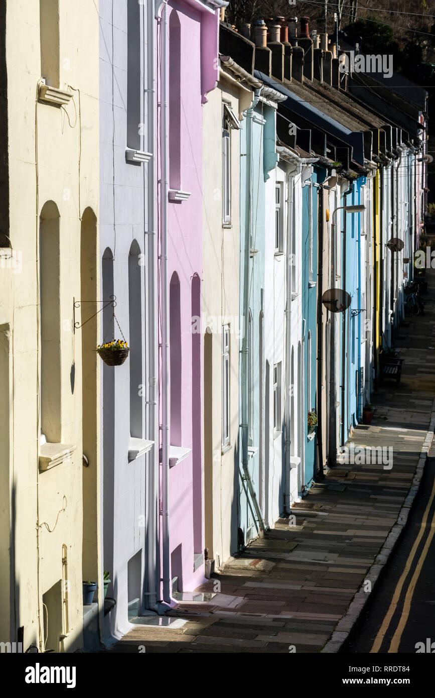 BRIGHTON, ENGLAND - FEBRUARY 25: Springlike sunshine brightens colourful terraced housing on February 25, 2019 in Brighton, England. (Photo by Andrew  Stock Photo
