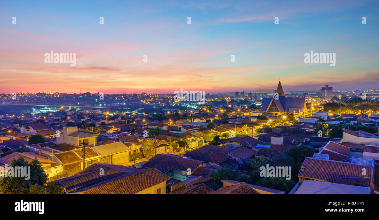 Sunrise in Araras, Brasil. The perfect start of a day with a beautiful sunrise, lighting up the city. Stock Photo