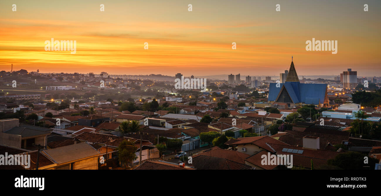 Sunrise in Araras, Brasil. The perfect start of a day with a beautiful sunrise, lighting up the city. Stock Photo
