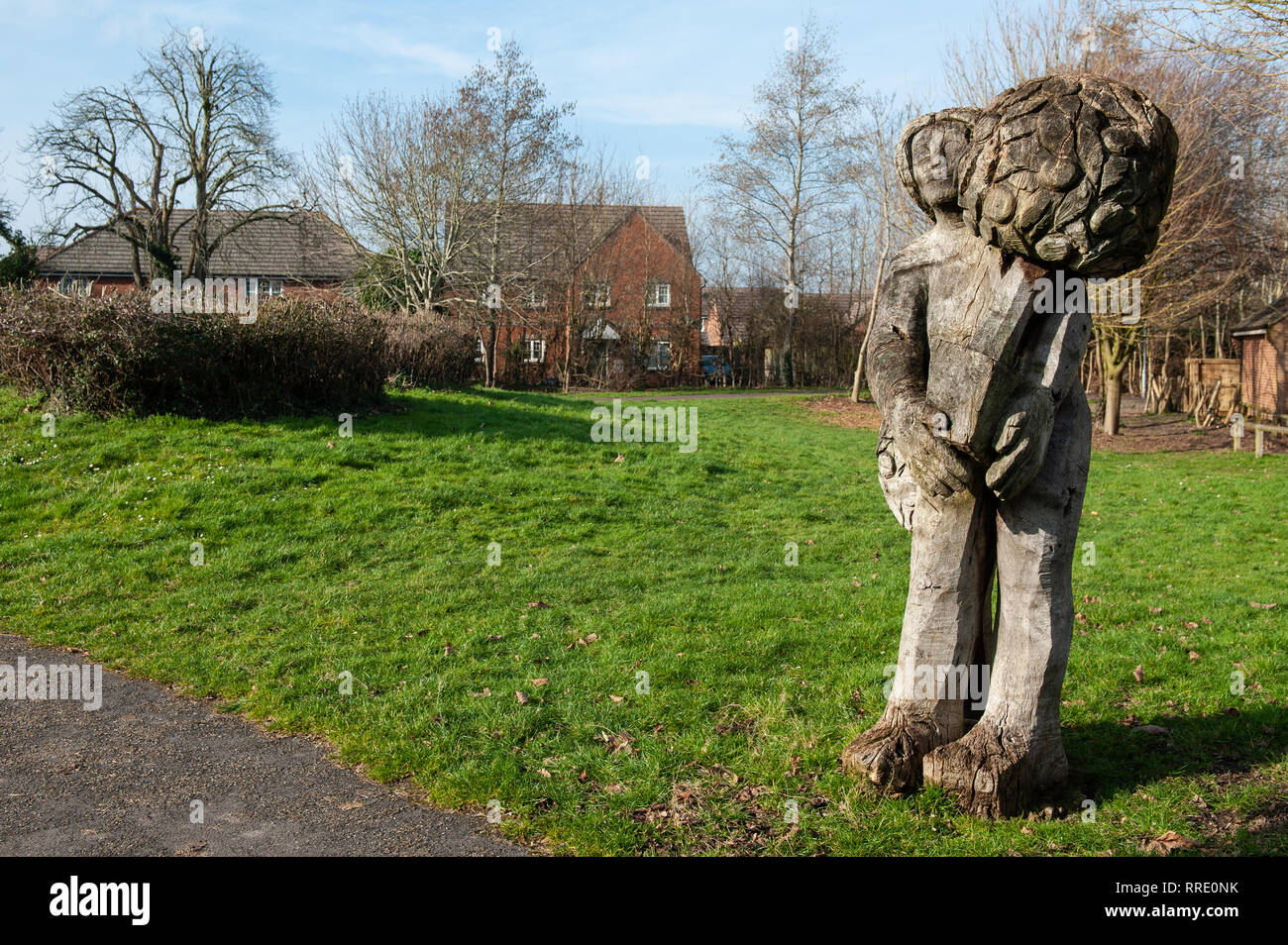 Wooden, carved figures on 'Telly Tubby Land', Leigh Park Estate, Westbury, Wiltshire, UK. Stock Photo