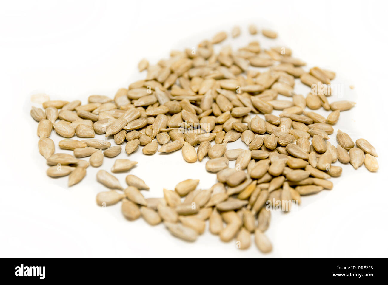 Pile of sunflower seeds isolated on white background. Vegan food Stock ...