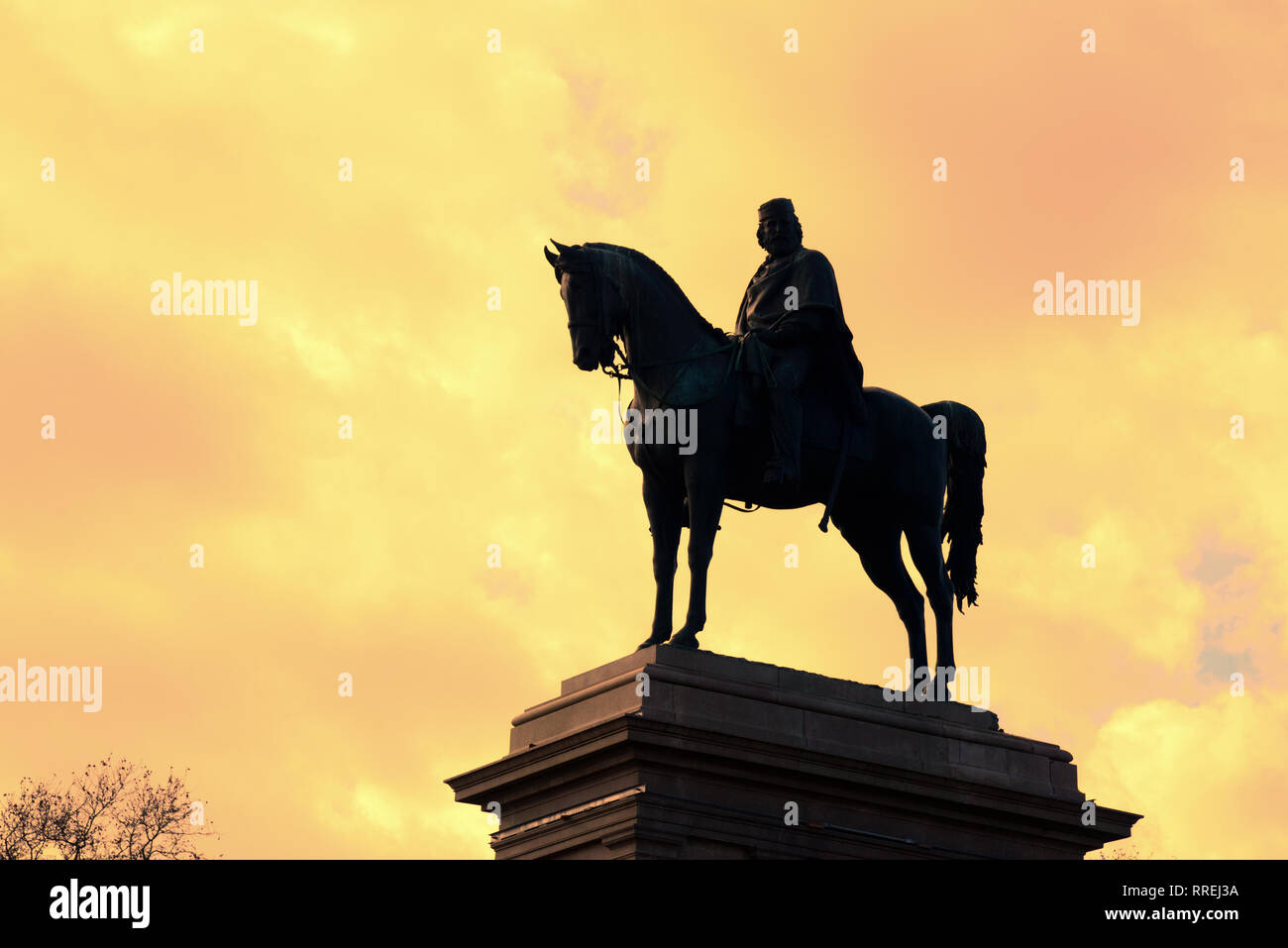 Equestrian Statue or Monument to Giuseppe Garibaldi (1895) Silhouetted Against the Setting Sun on Janiculum Hill or Park Rome Italy Stock Photo