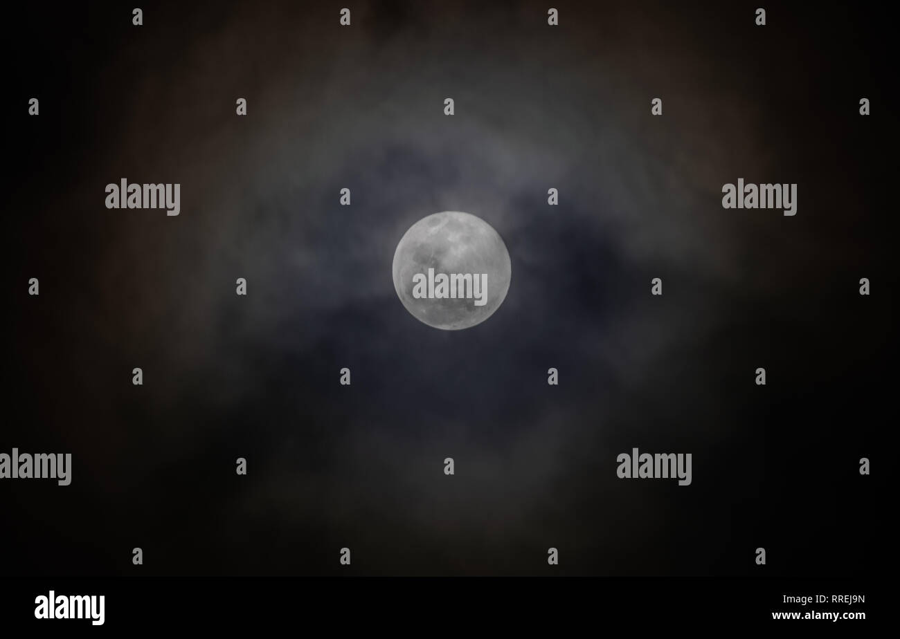 Full moon, with clouds passing over Stock Photo