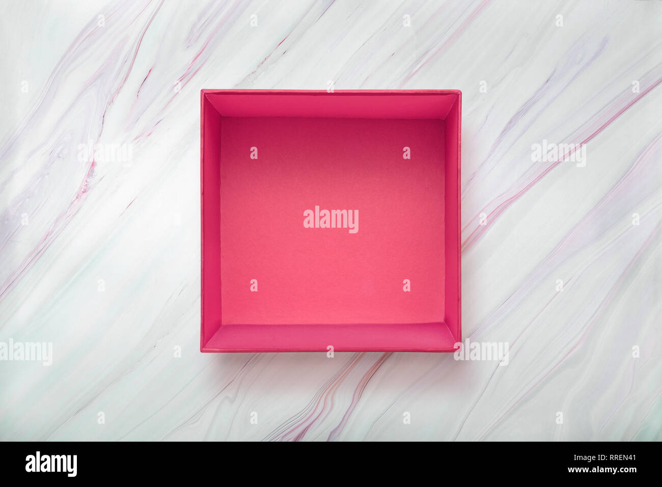 Open blank pink gift box on natural marble background. Pink cardboard ...