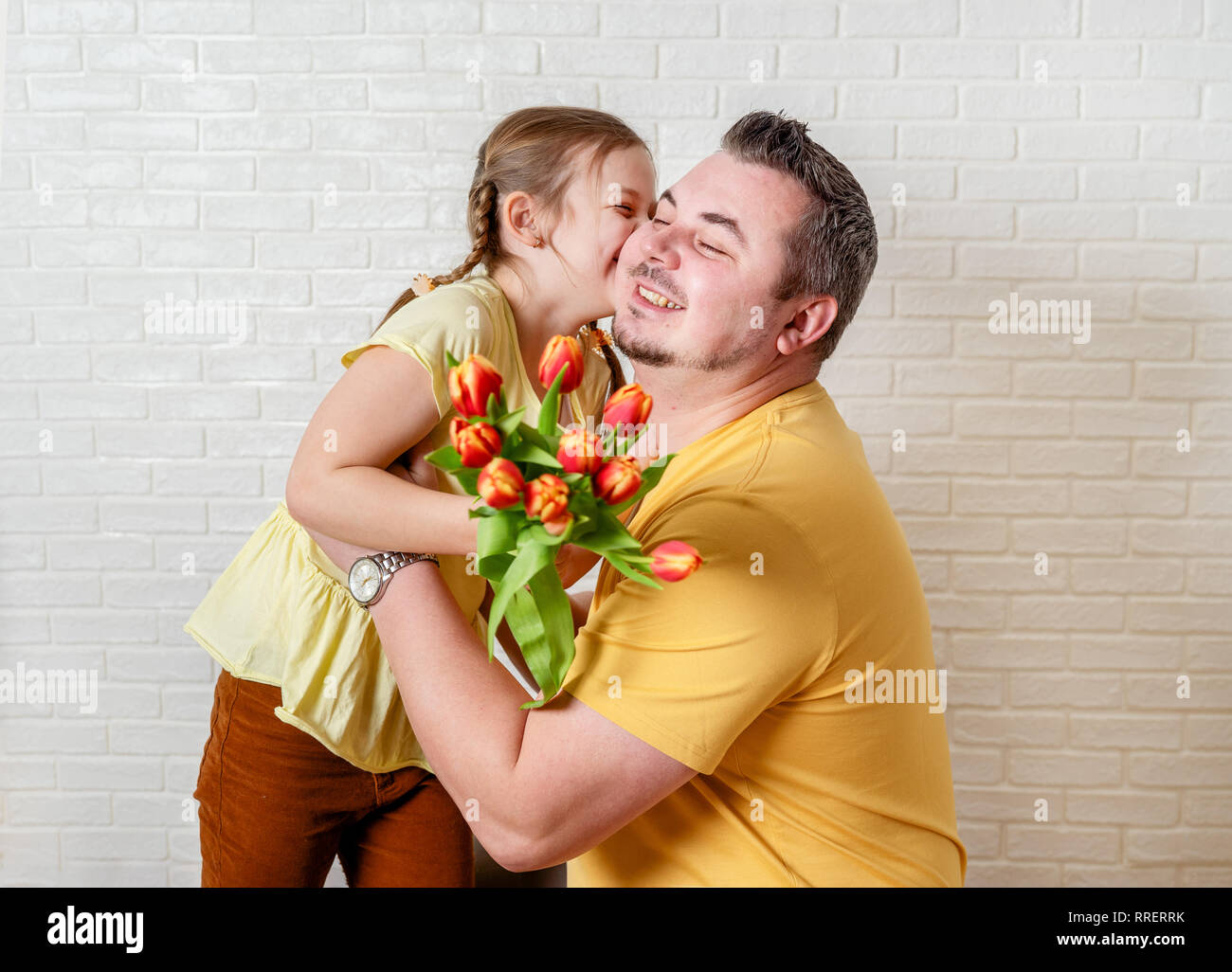 Father giving daughter flowers hires stock photography and images Alamy