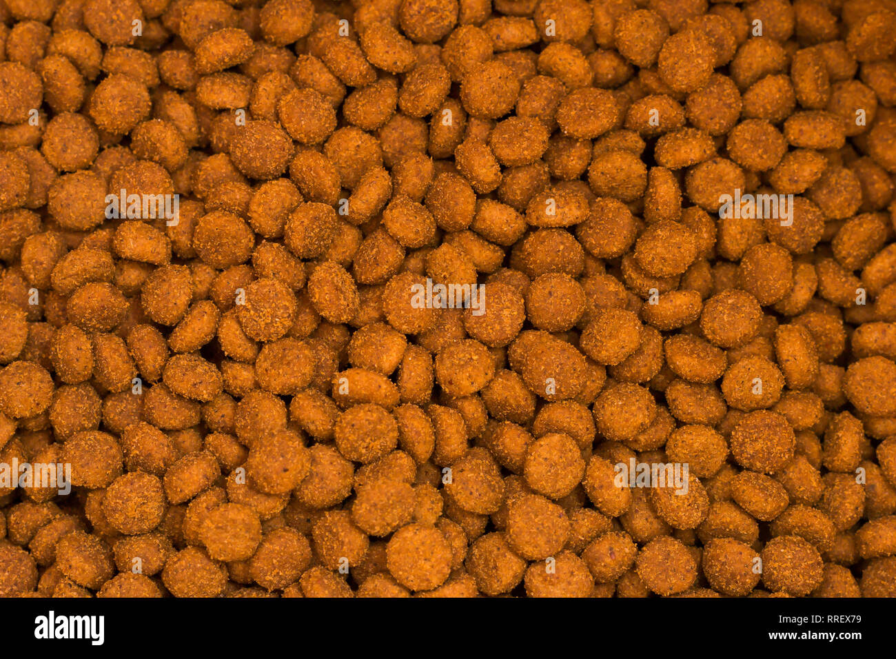 Pet kibbles close-up. Dog and cat dry food Stock Photo - Alamy