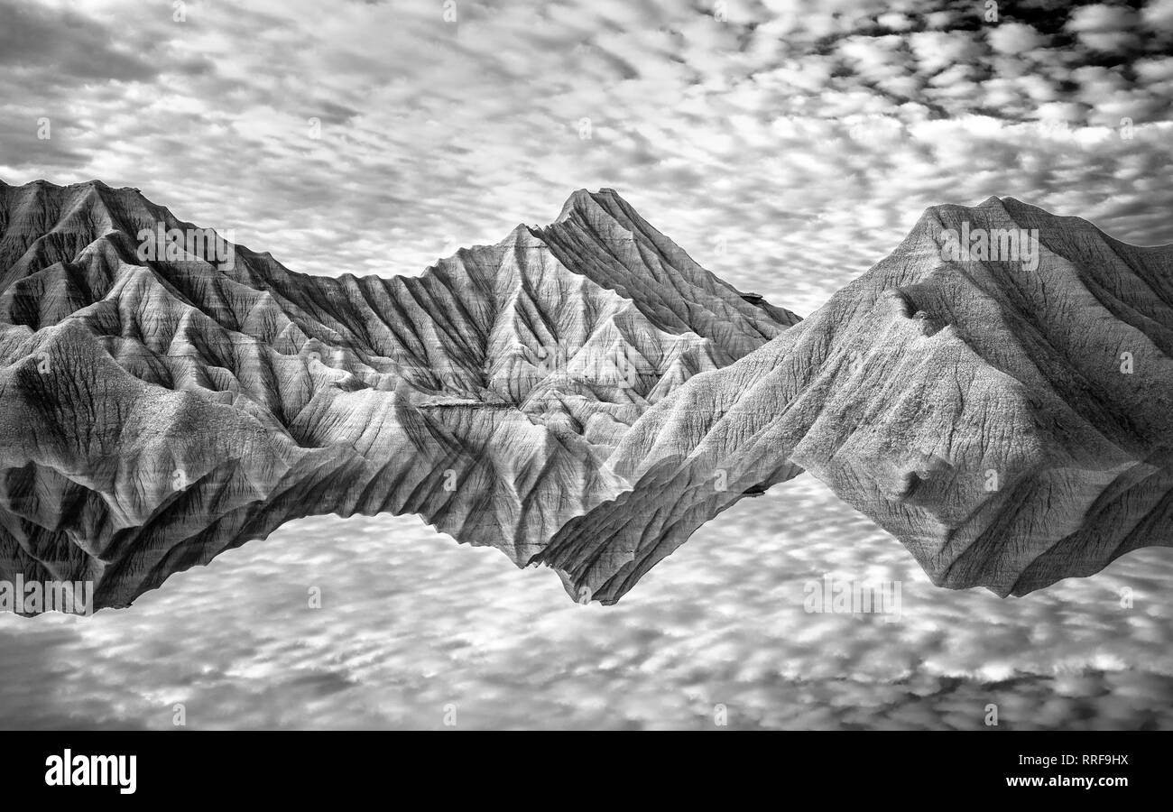 Water surface near rock mountains and blue heaven in Bardenas Reales, Navarra, Spain Stock Photo