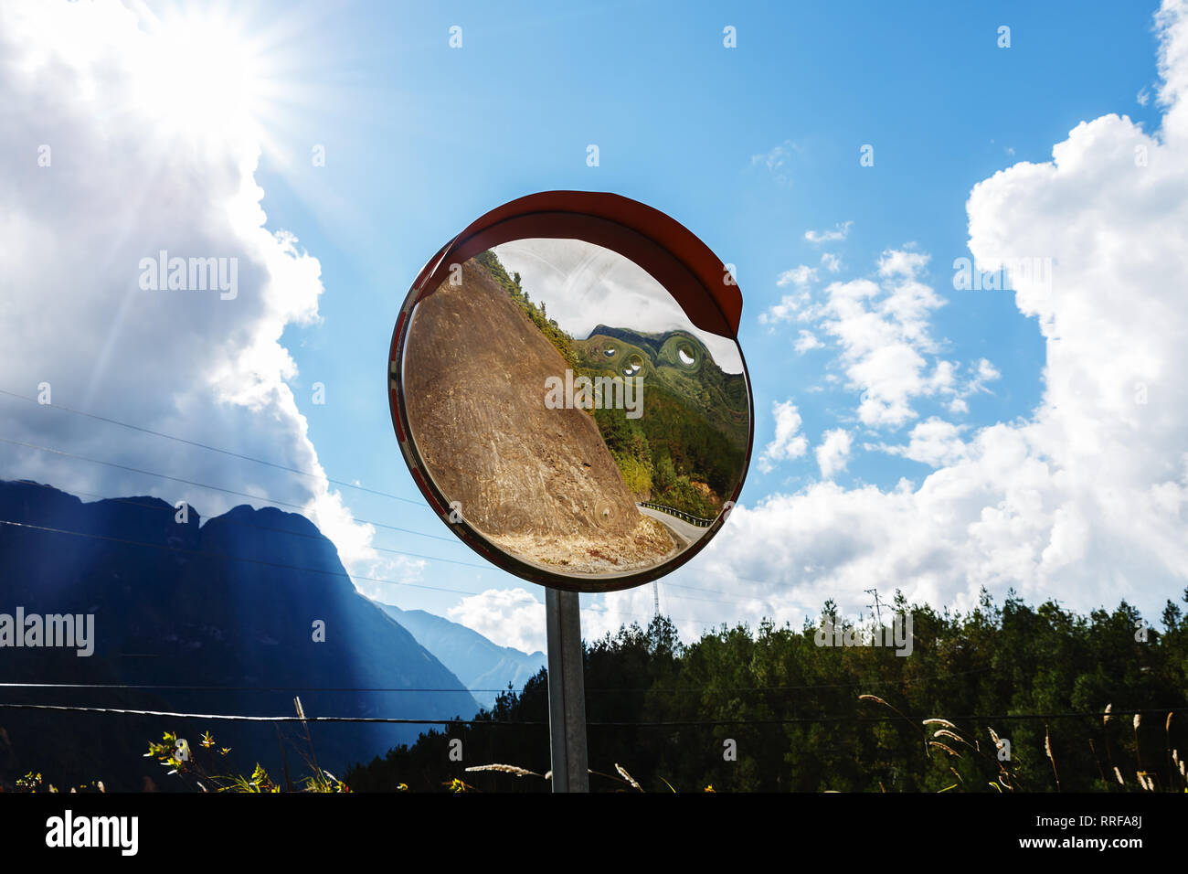 Reflections of the road on traffic mirror for traffic safety. Traffic mirror Stock Photo