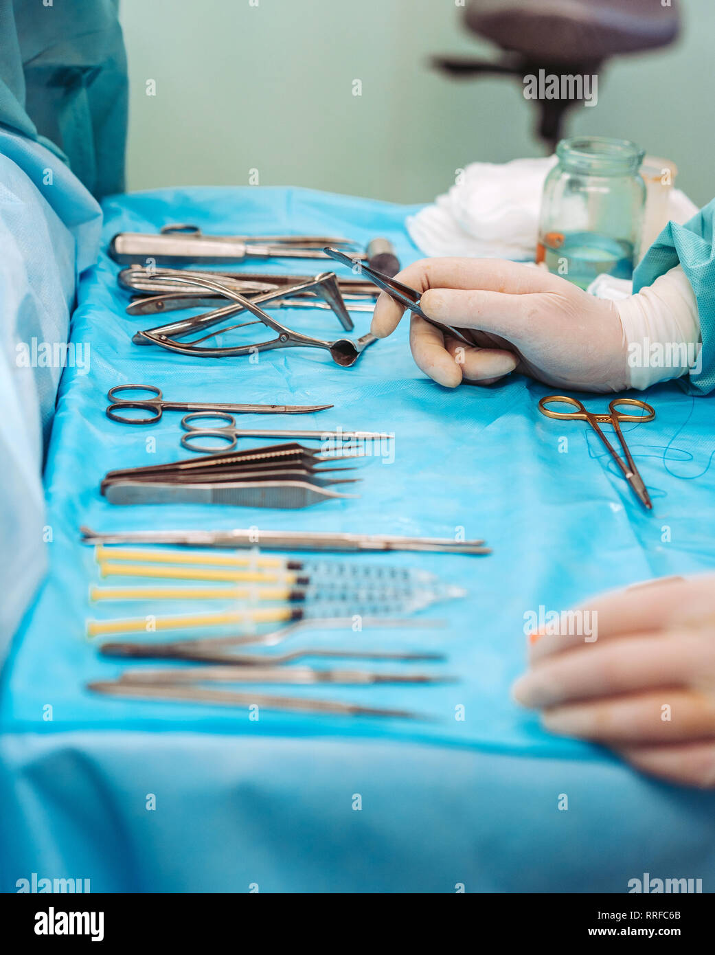 Scrub nurse preparing medical instruments for operation Stock Photo Alamy