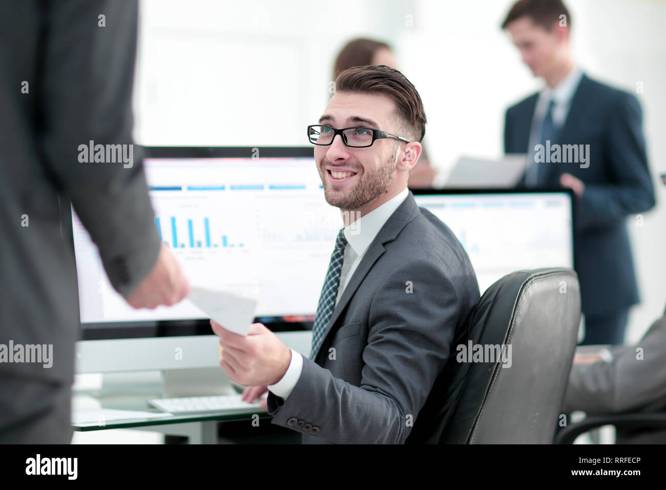 businessman working on a computer on business reports Stock Photo