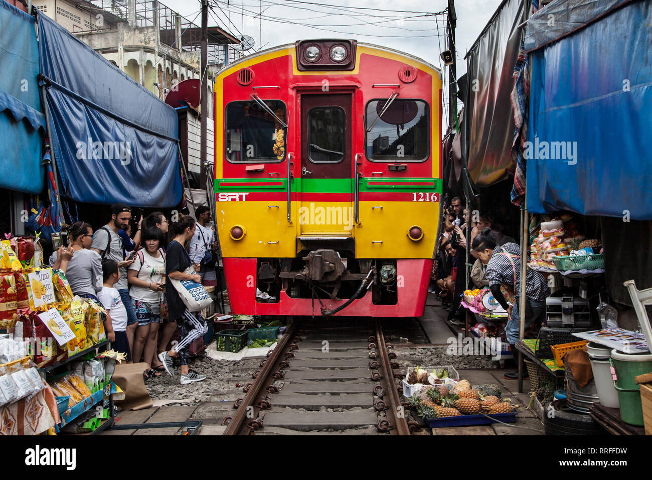 Maeklong, Thailand - August 29, 2018: Train passing through the Railway Market in Maeklong, Samut Songkhram, Thailand. This market is one of the most  Stock Photo
