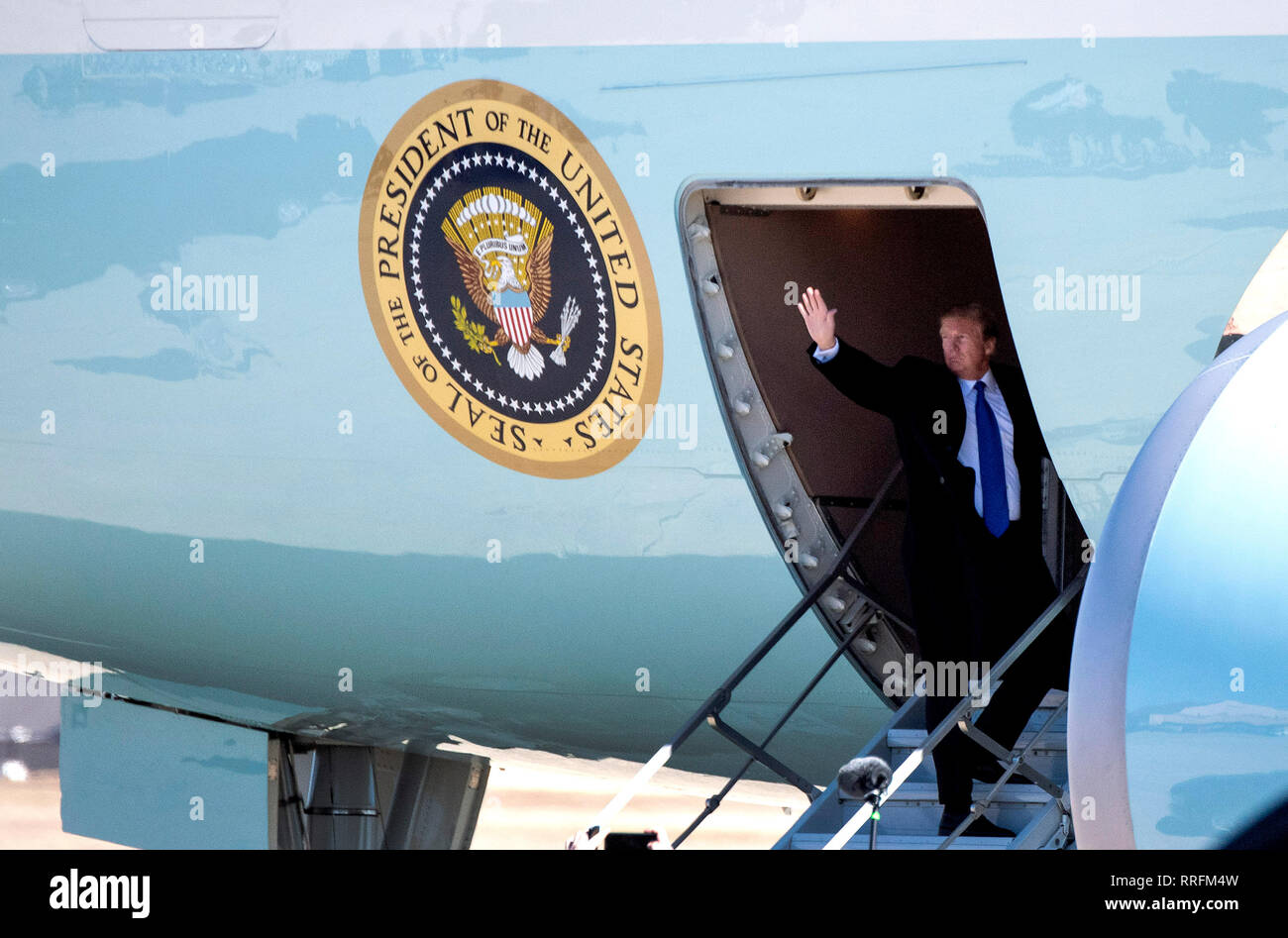 United States President Donald J. Trump waves as he boards Air Force One as he departs for Vietnam for a summit with North Korean leader Kim Jong Un, at Joint Base Andrews, February 25, 2019. This will be the second summit between North Korea and the United States on denuclearization of the Korean Peninsula. Credit: Kevin Dietsch/Pool via CNP | usage worldwide Stock Photo