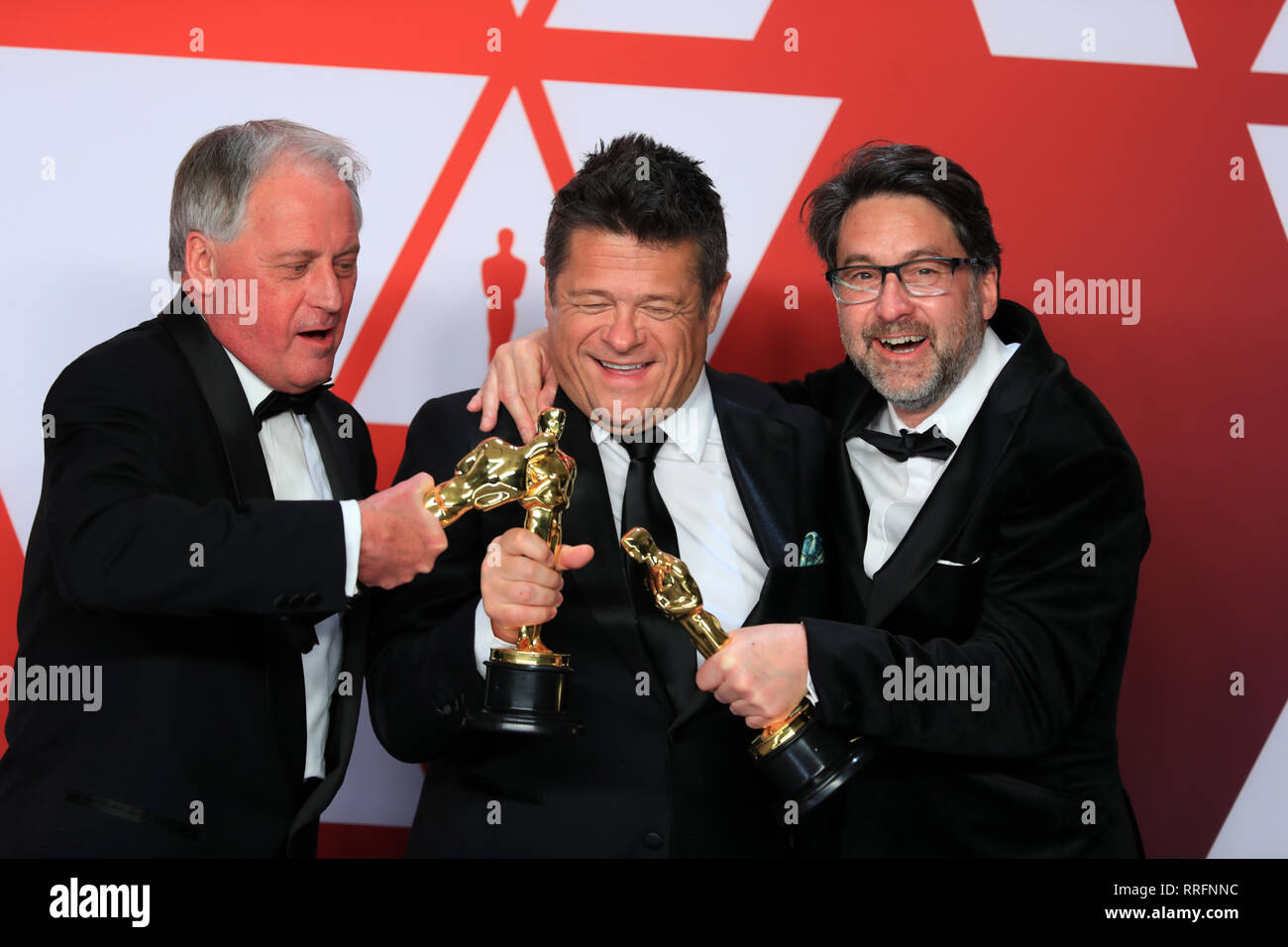 Los Angeles, USA. 24th Feb, 2019. (L-R) Paul Massey, Tim Cavagin and John Casali, winners of the Best Sound Mixing award for ' Bohemian Rhapsody,' pose for photos in the press room during the 91st Academy Awards (Oscars) ceremony at the Dolby Theatre in Los Angeles, the United States, on Feb. 24, 2019. Credit: Li Ying/Xinhua/Alamy Live News Stock Photo