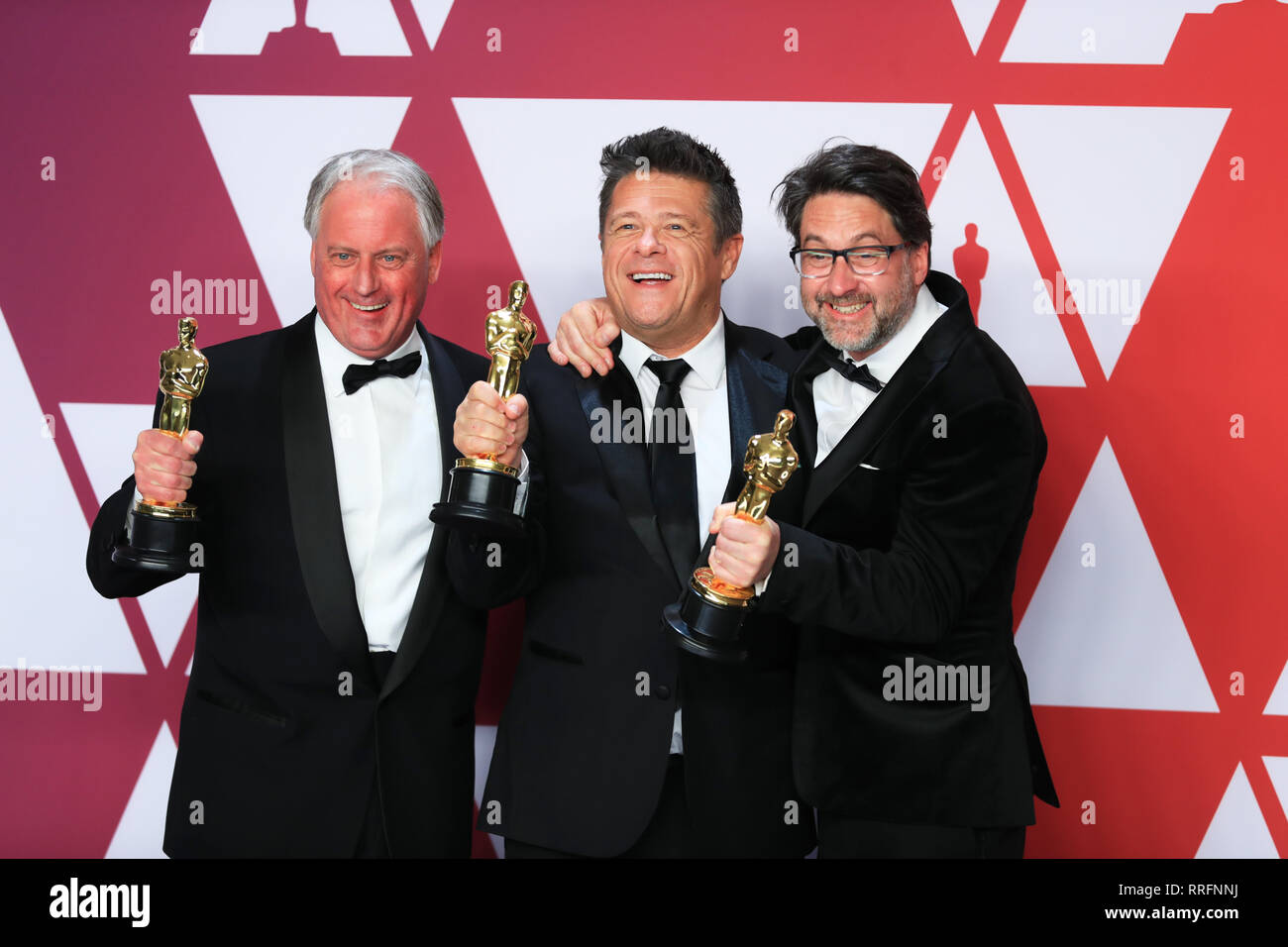 Los Angeles, USA. 24th Feb, 2019. (L-R) Paul Massey, Tim Cavagin and John Casali, winners of the Best Sound Mixing award for ' Bohemian Rhapsody,' pose for photos in the press room during the 91st Academy Awards (Oscars) ceremony at the Dolby Theatre in Los Angeles, the United States, on Feb. 24, 2019. Credit: Li Ying/Xinhua/Alamy Live News Stock Photo