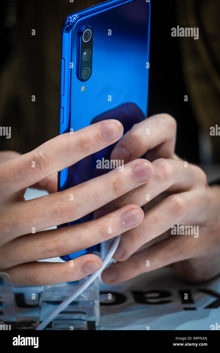 The new blue color model of Xiaomi 9 is seen during the MWC2019. The MWC2019 Mobile World Congress opens its doors to showcase the latest news of the manufacturers of smart phones. The presence of devices prepared to manage 5G communications has been the hallmark of this edition. Stock Photo