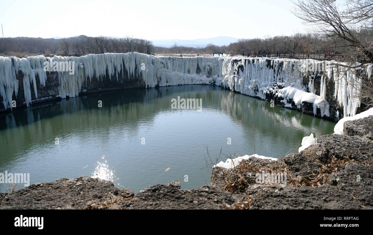 Mudanjiang, China's Heilongjiang Province. 25th Feb, 2019. The frozen Diaoshuilou Waterfall is seen at the Jingpo Lake in Mudanjiang, northeast China's Heilongjiang Province, Feb. 25, 2019. Credit: Wang Jianwei/Xinhua/Alamy Live News Stock Photo