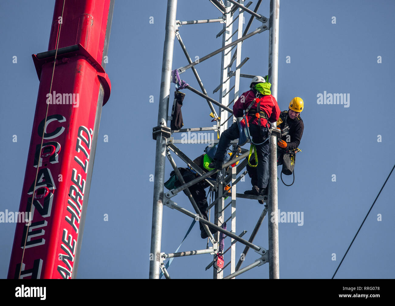 Goats Cross, Crosshaven, Cork, Ireland. 26th February, 2019. Telecom engineers aloft a new communication mast  for 5G technology, being installed at Goat's Cross, Crosshaven, Co. Cork, Ireland. Credit: David Creedon/Alamy Live News Stock Photo