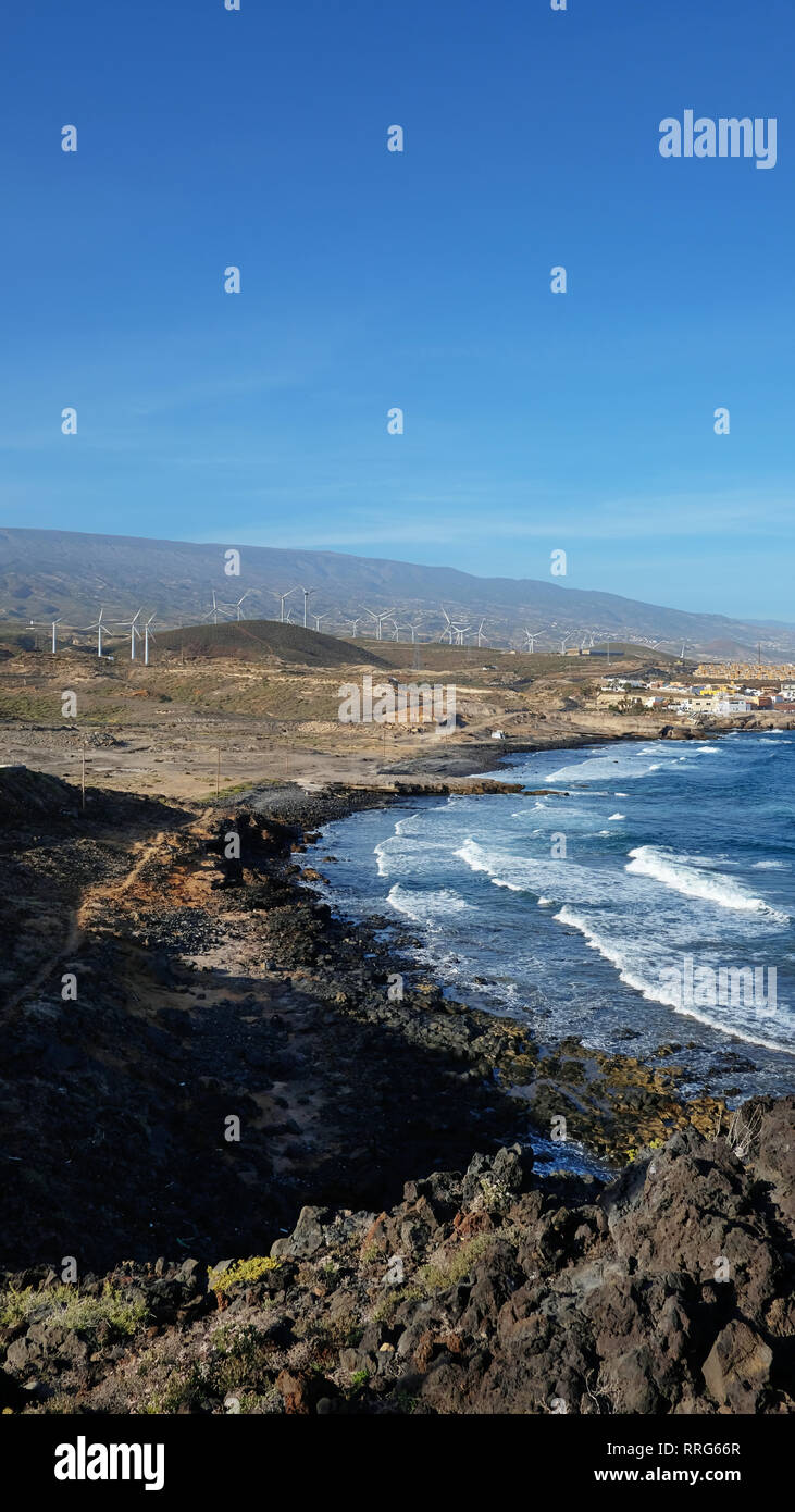 Vertical, narrow perspective of an empty and clean beautiful beach with inland views of the south-eastern coast of the island, at Playa Poris de Abona Stock Photo