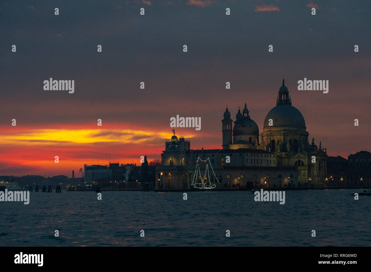 Santa Maria della Salute, commonly known simply as the Salute, at sunset in Venice. From a series of travel photos in Italy. Photo date: Monday, Febru Stock Photo