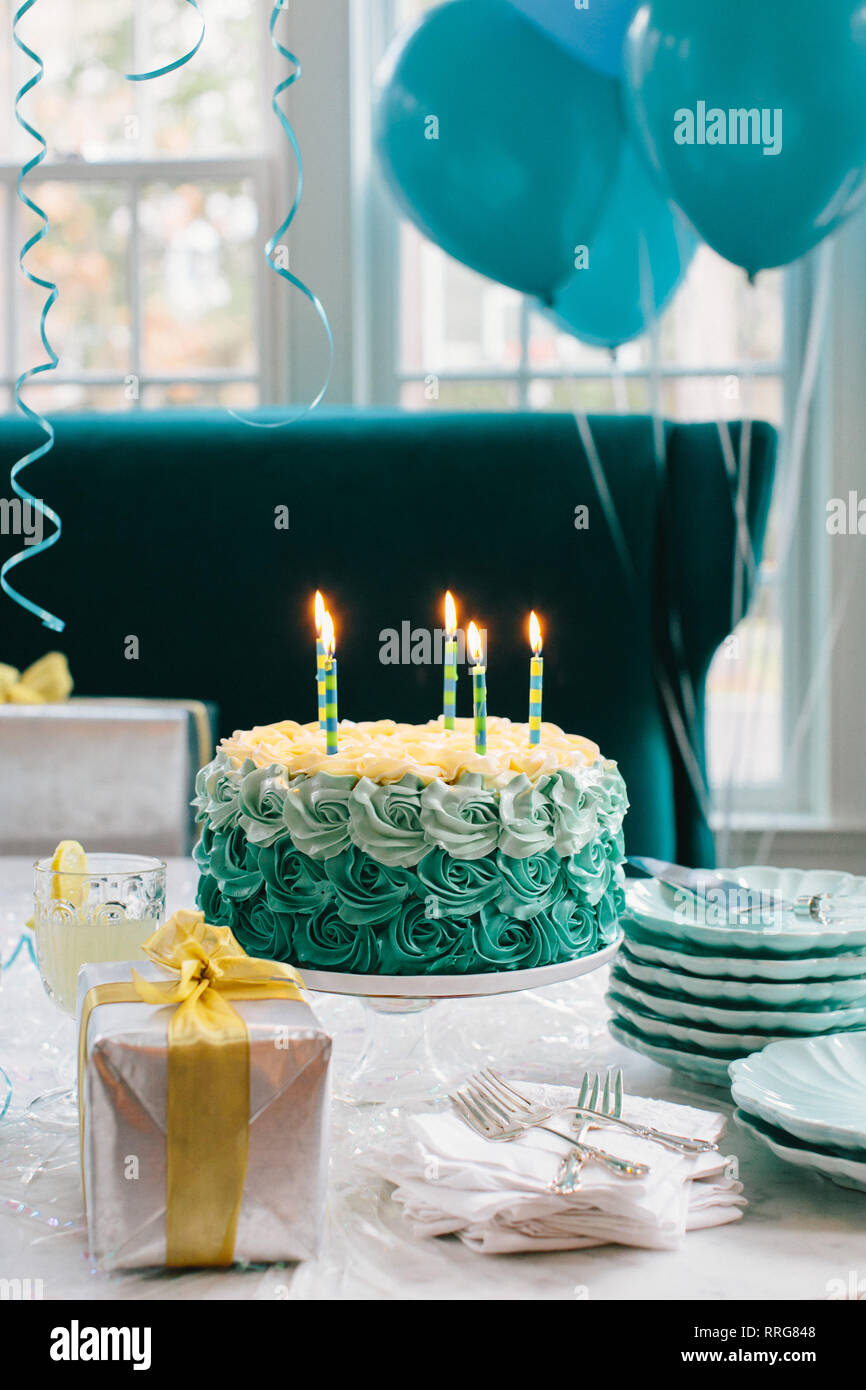 Blue Birthday Cake with Lit Candles Stock Photo - Alamy