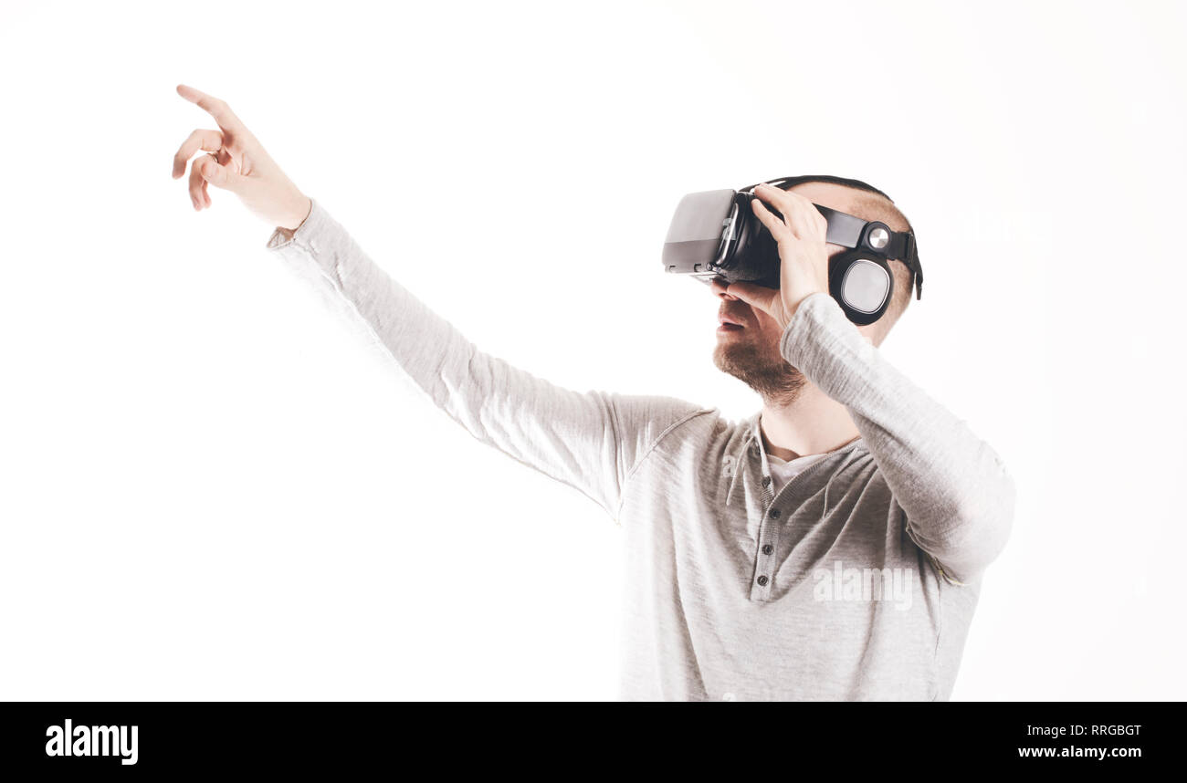 Man using virtual reality headset at white background Stock Photo