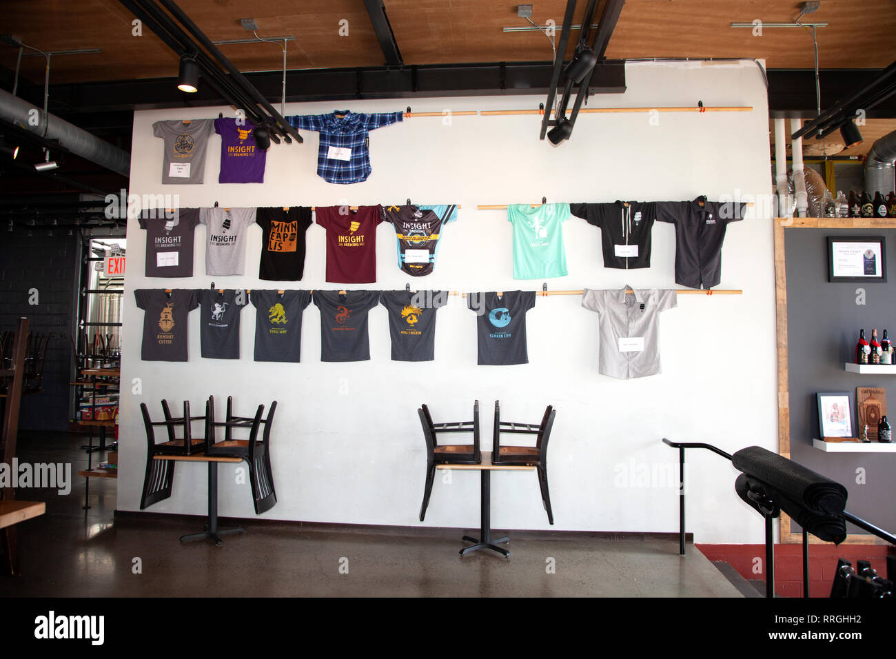 T-shirts with the company logo on display in The Insight Brewing taproom. Minneapolis Minnesota MN USA Stock Photo