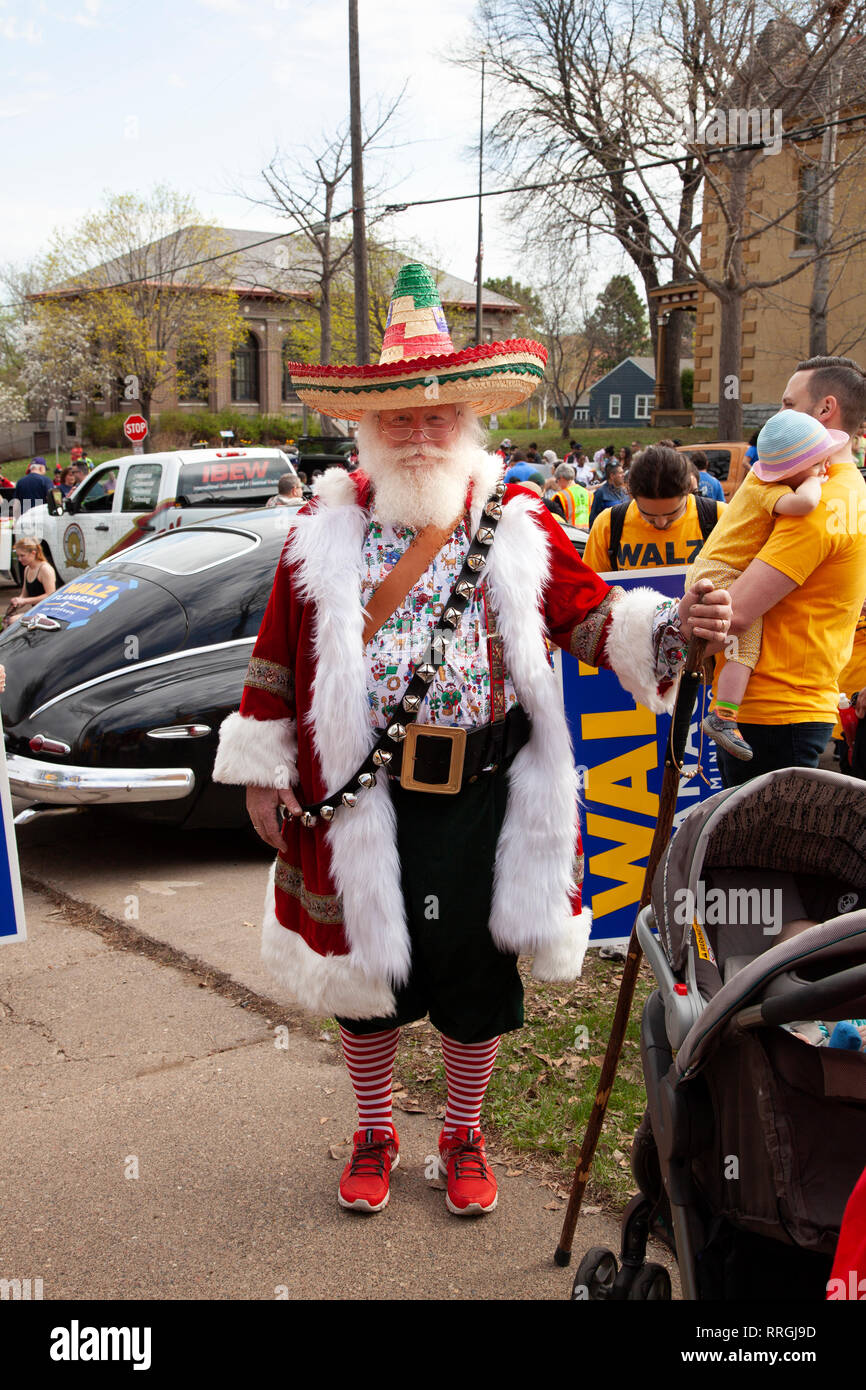 Mexican Santa Claus dressed in a sombrero, bells and decorated coat for the Cinco de Mayo Parade. St Paul Minnesota MN USA Stock Photo