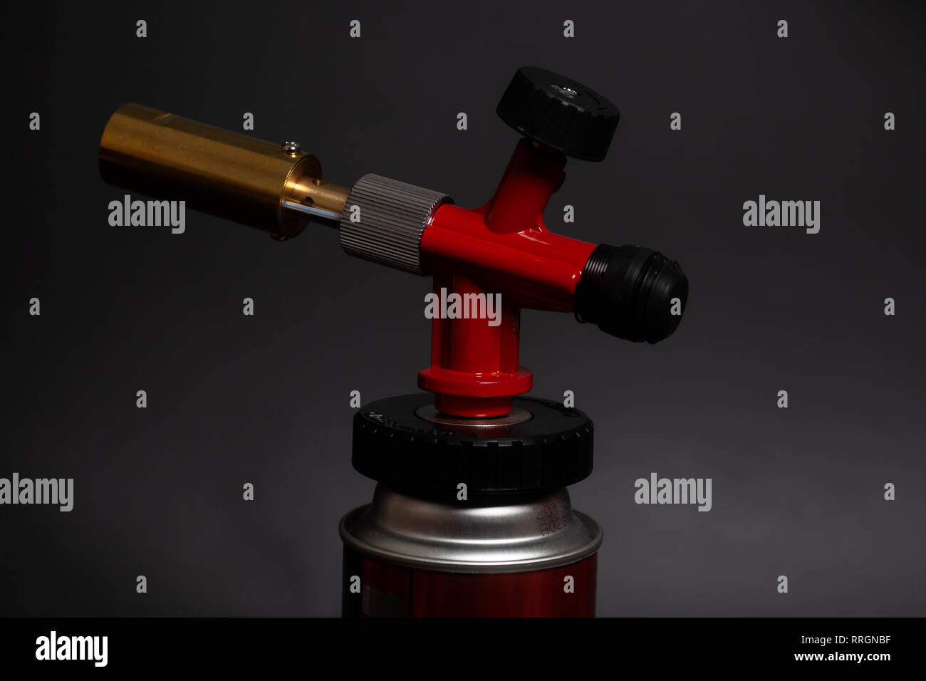 Manual gas burner isolated on black background Stock Photo Alamy