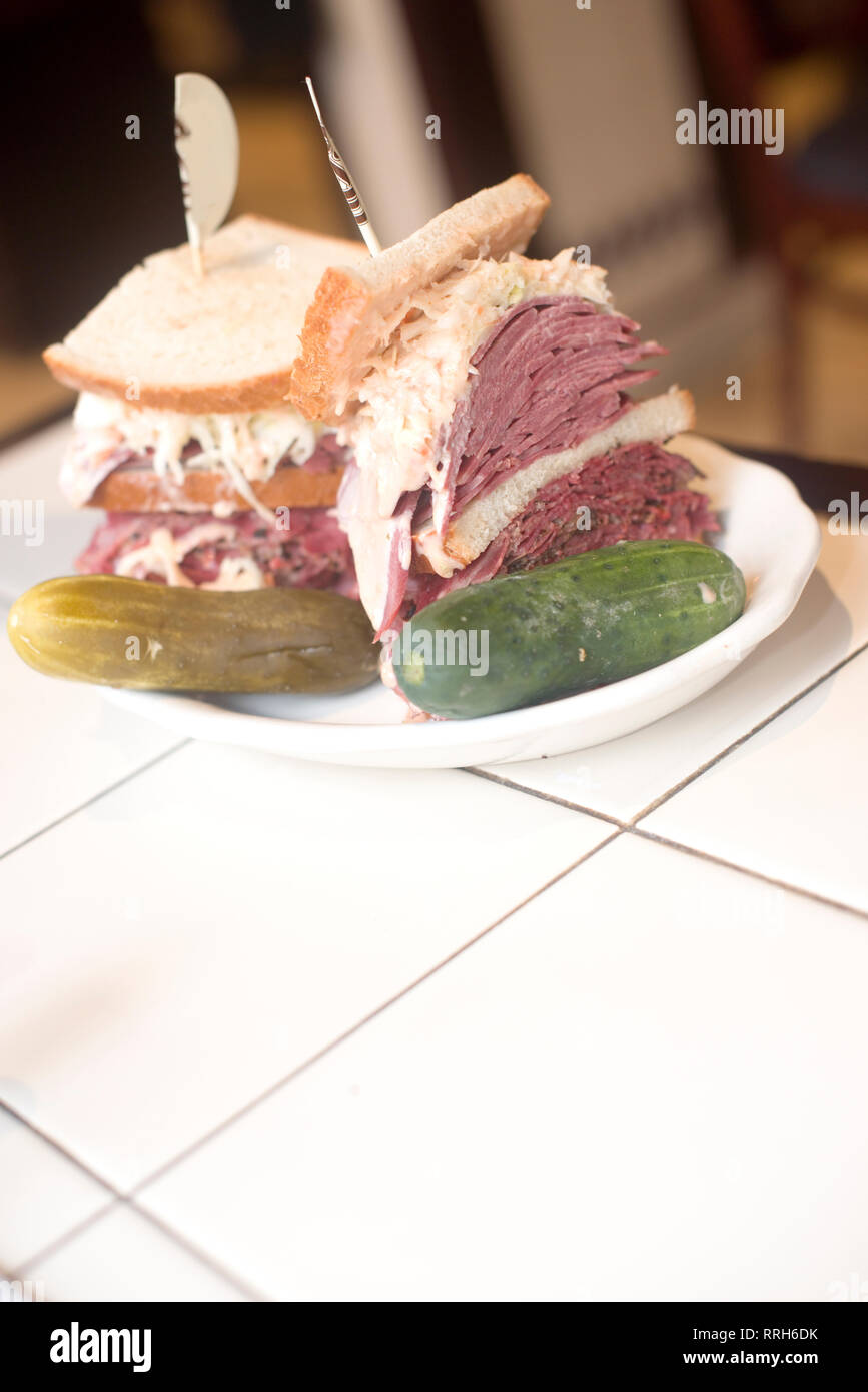 Kosher deli combination sandwich pastrami corned beef tongue cole slaw and Russian dressing on