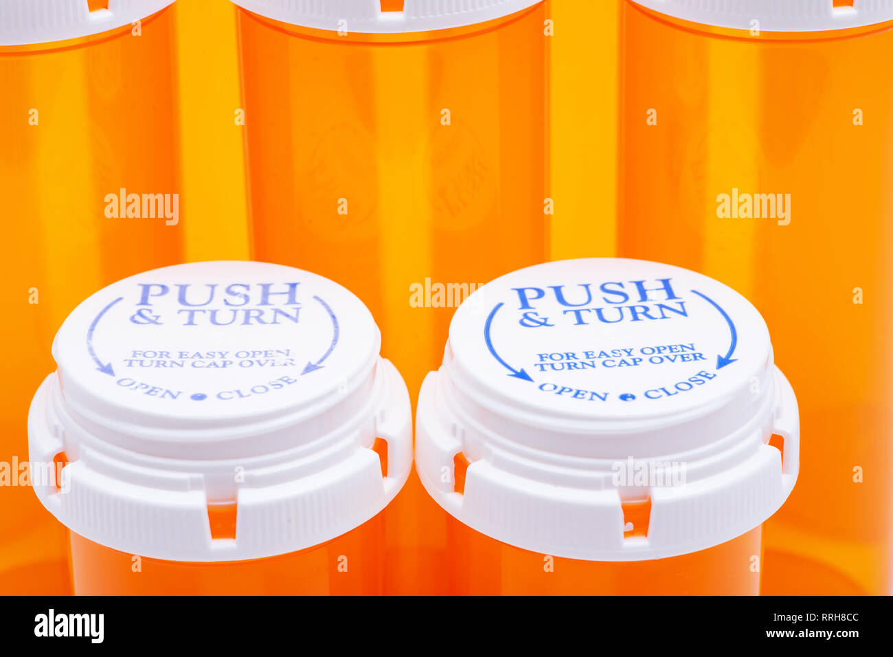 https://c8.alamy.com/comp/RRH8CC/orange-plastic-empty-prescription-containers-with-child-resistant-pushturn-cap-RRH8CC.jpg