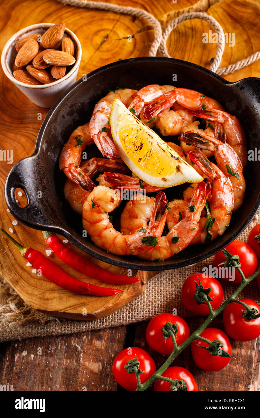 Fried large shrimp in tomato sauce with olive oil, garlic, cilantro and