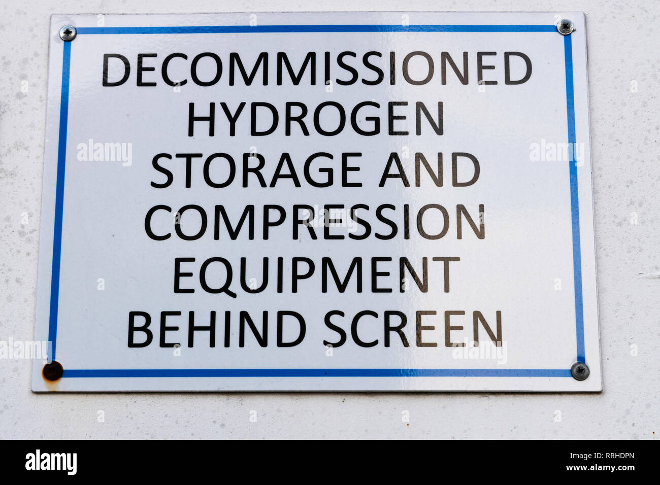 Decommissioned hydrogen storage and compression equipment sign Stock Photo