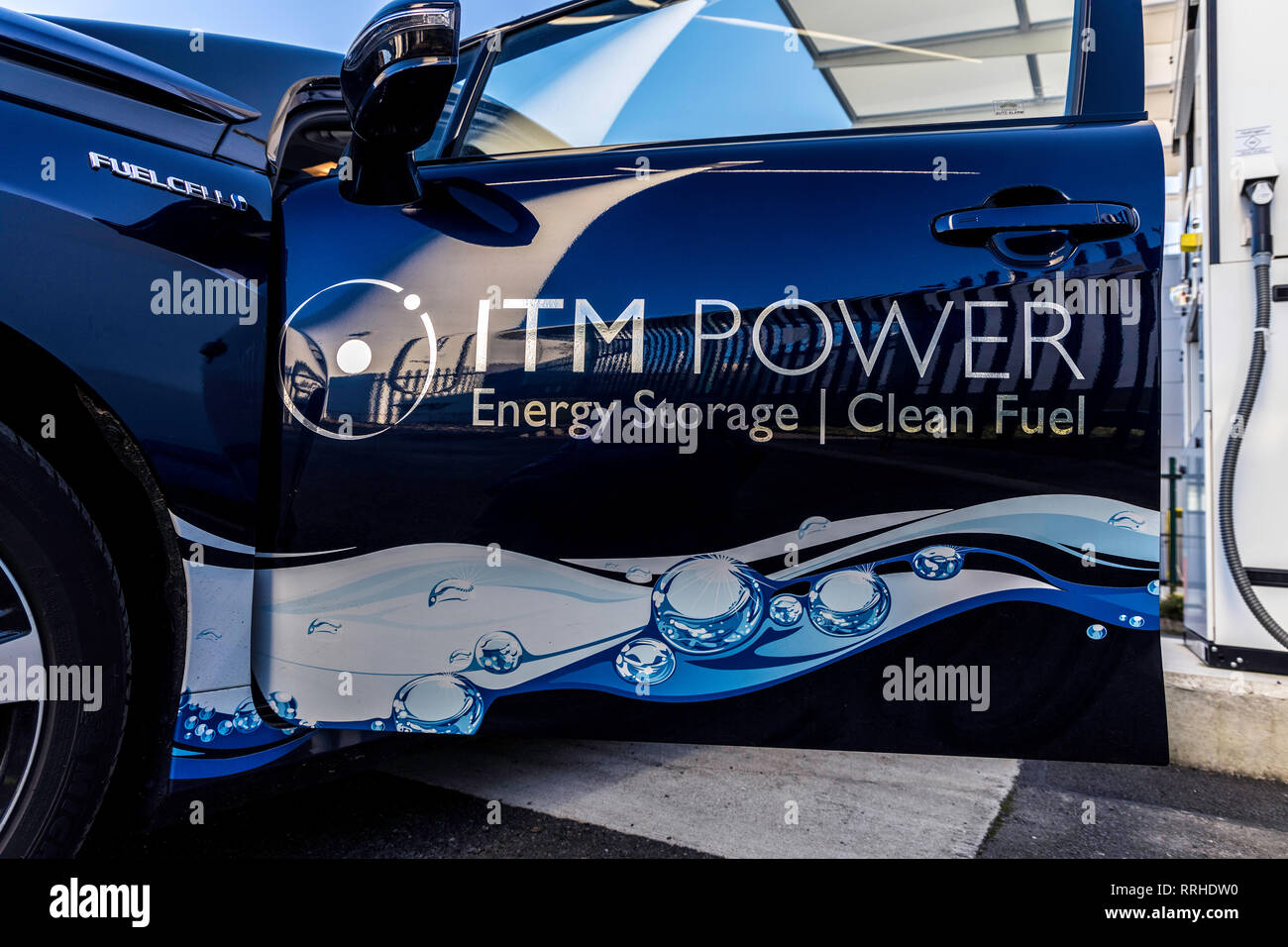 ITM Power: Hydrogen Car with reflections of wind turbine Stock Photo