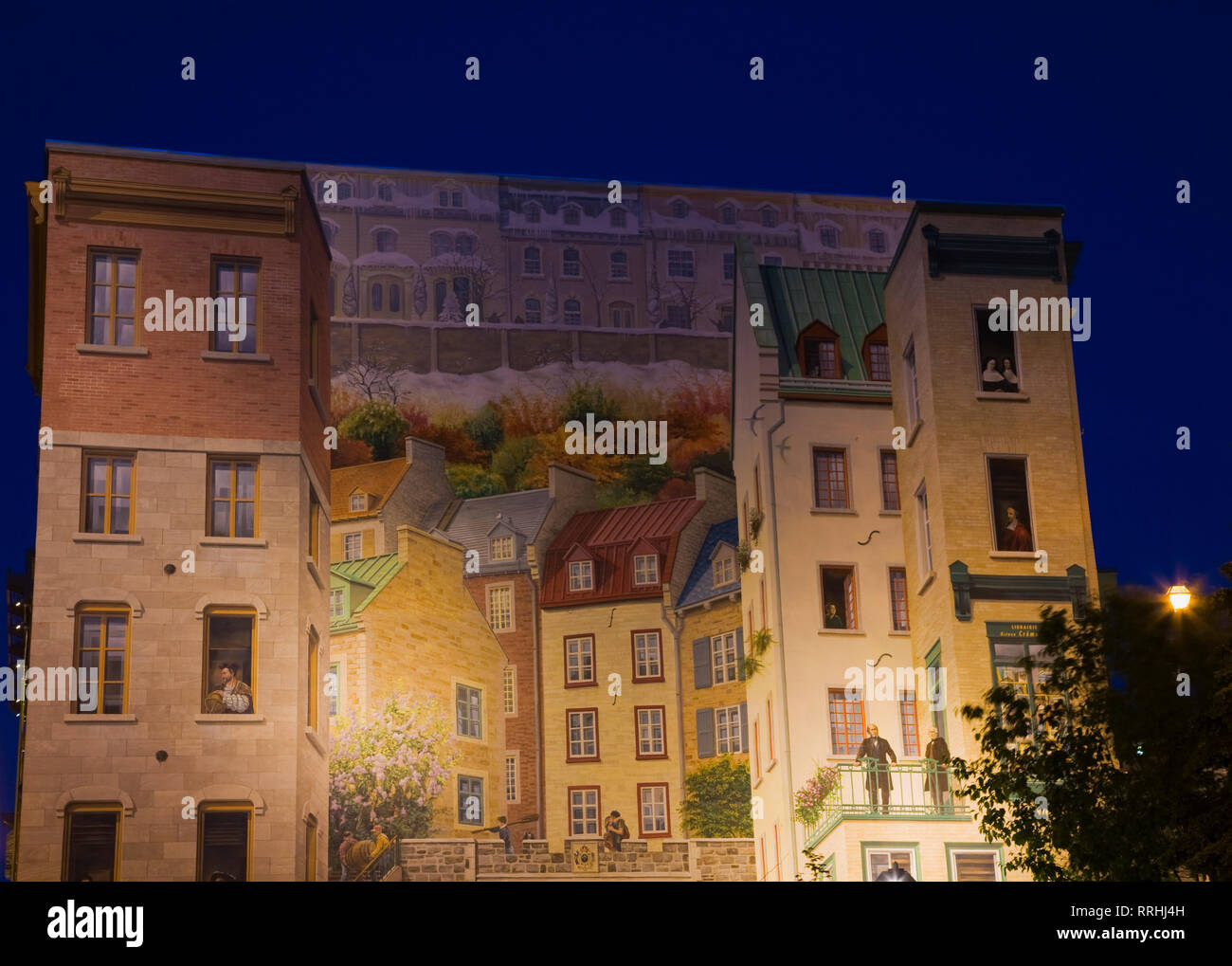 La Fresque des Quebecois wall mural illuminated at night, Notre-Dame street, Old Quebec City, Quebec, Canada Stock Photo