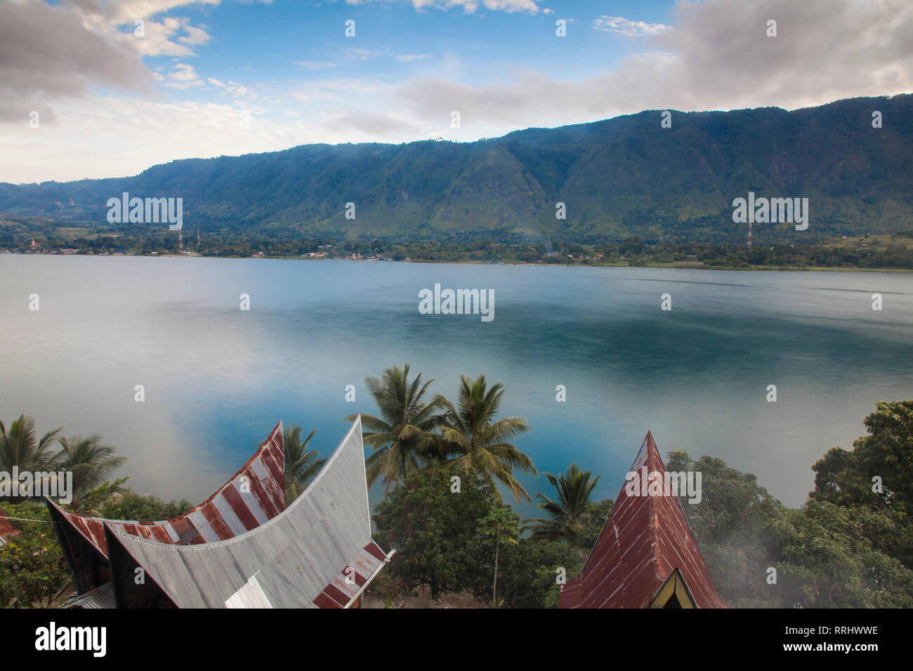 Typical Batak houses overlooking Lake Toba, Tuk Tuk, Lake Toba, Samosir Island, Sumatra, Indonesia, Southeast Asia, Asia Stock Photo