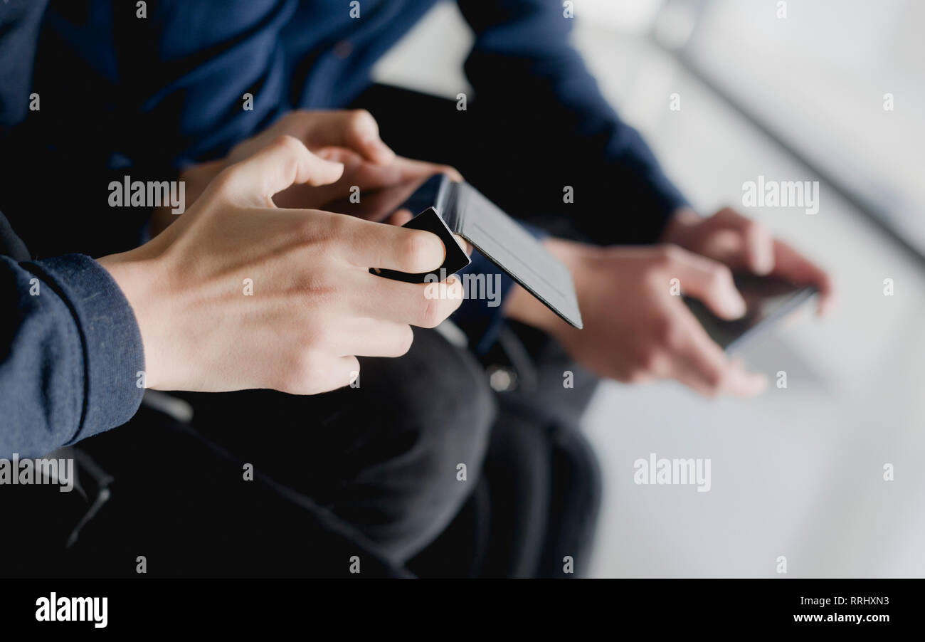 Group of diverse friends playing game on mobile phone Stock Photo