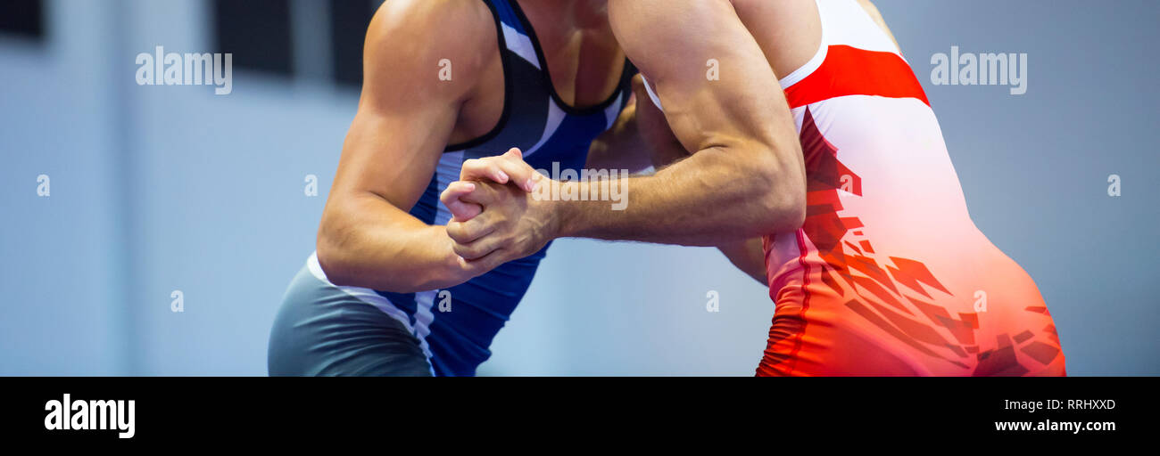 Two wrestlers Greco-Roman wrestling during competition Stock Photo