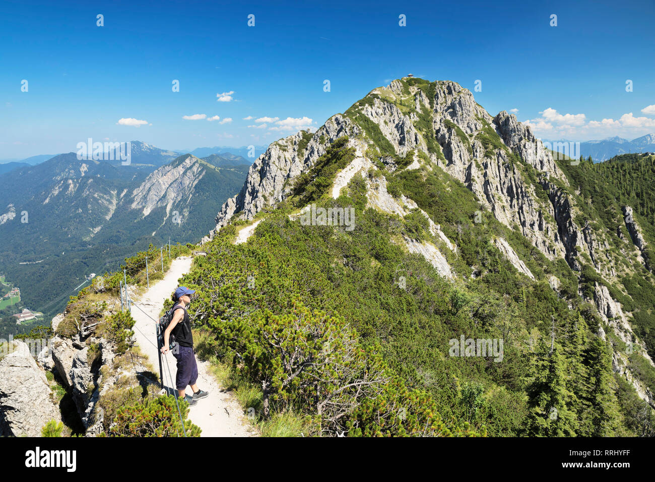 Hiker on Gratweg Trail from Heimgarten to Herzogstand Mountain, Upper Bavaria, Bavaria, Germany, Europe Stock Photo