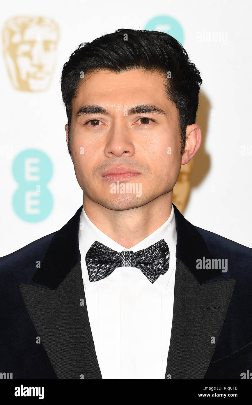 Henry Golding attends the EE British Academy Film Awards at The Royal Albert Hall in London. 10th February 2019 © Paul Treadway Stock Photo