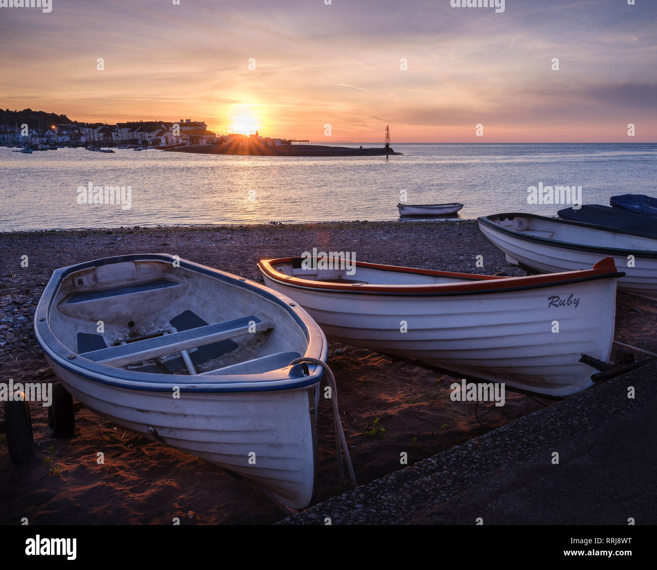 Boats at sunrise looking across entrance to Teign estuary to Teignmouth