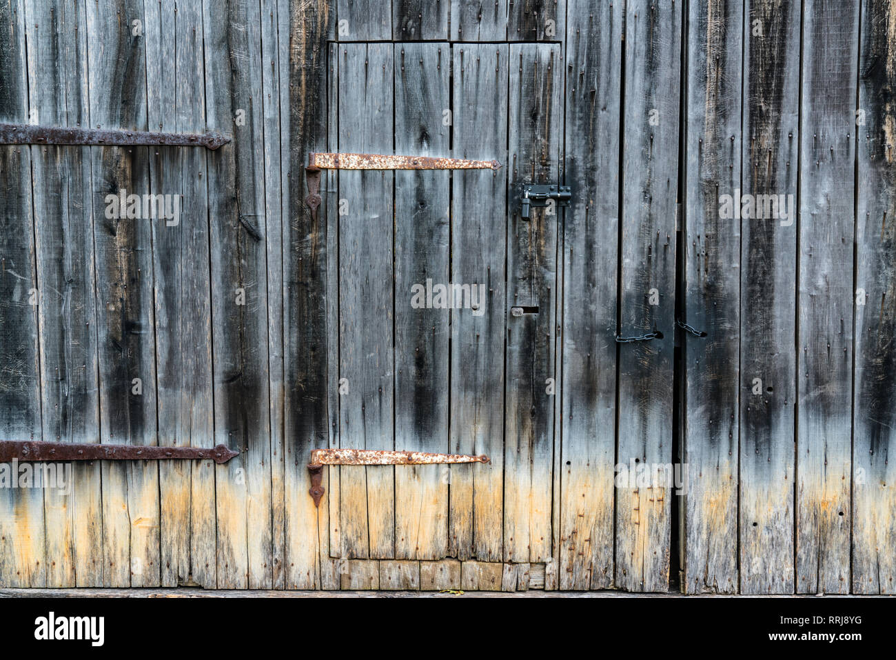 Old vintage, rustic weathered barn door Stock Photo