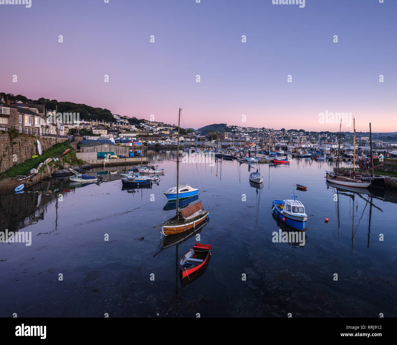 Twilight looking across the inner harbours at the fishing port of Newlyn, Cornwall, England, United Kingdom, Europe Stock Photo