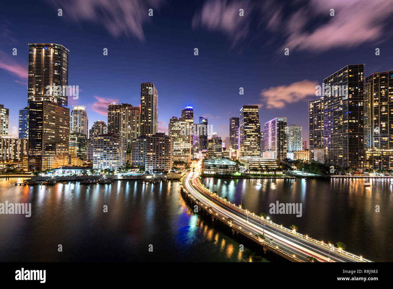 Bridge leading to Brickell Key and Downtown Miami skyline at night, Florida, United States of America, North America Stock Photo
