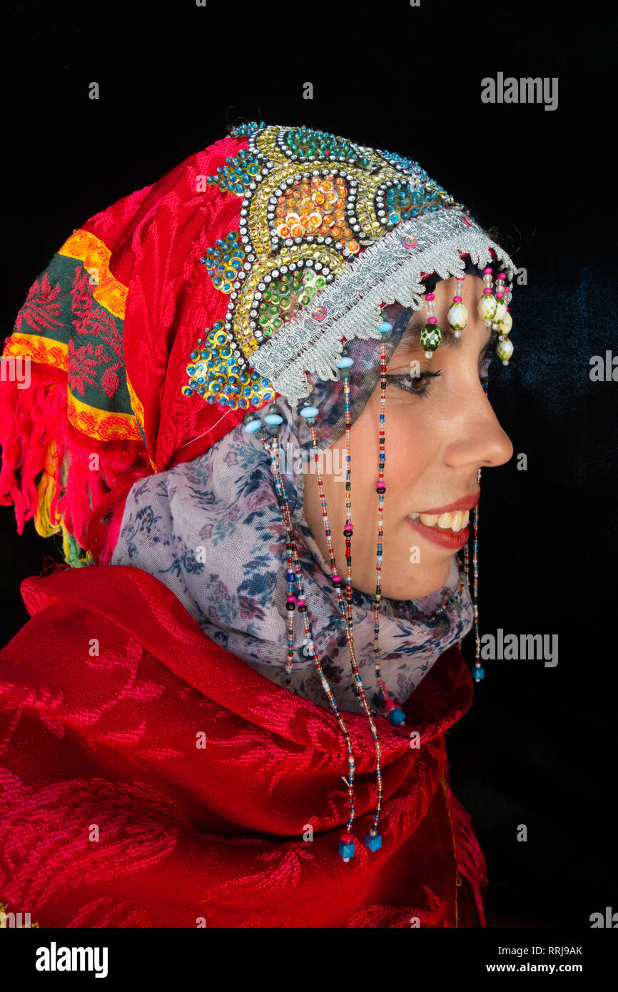 Close-up side portrait of beautiful young Moroccan woman in traditional Berber dress, in Chefchaouen, Morocco, North Africa, Africa Stock Photo