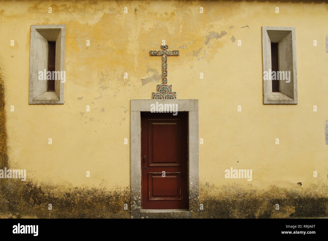 Side door with tiled cross of a church in Sintra, Portugal, Europe Stock Photo