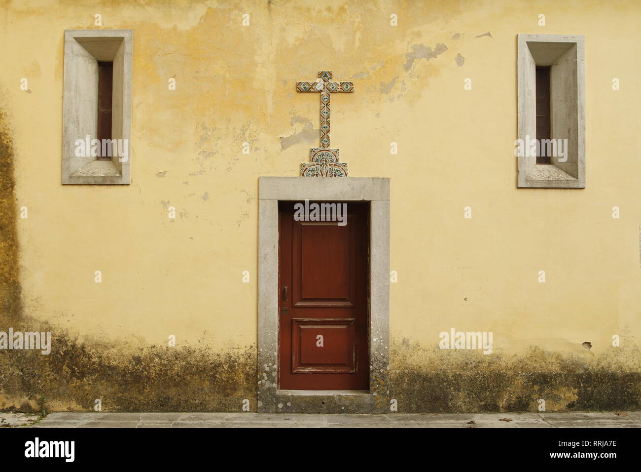 Side door with tiled cross of a church in Sintra, Portugal, Europe Stock Photo