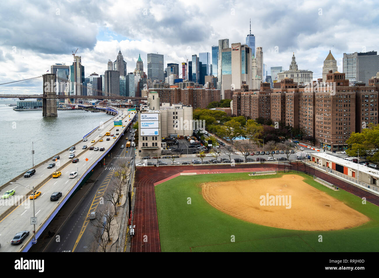 A baseball field along the FDR and East River with views towards the  Brooklyn Bridge and Lower Manhattan, New York, United States of America  Stock Photo - Alamy